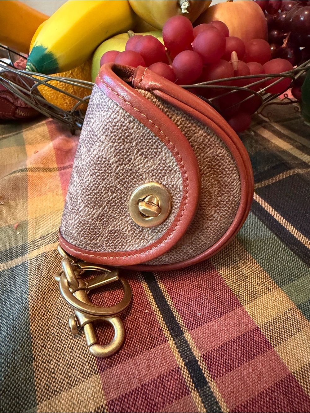 Coach mini saddle bag charm in signature coated canvas